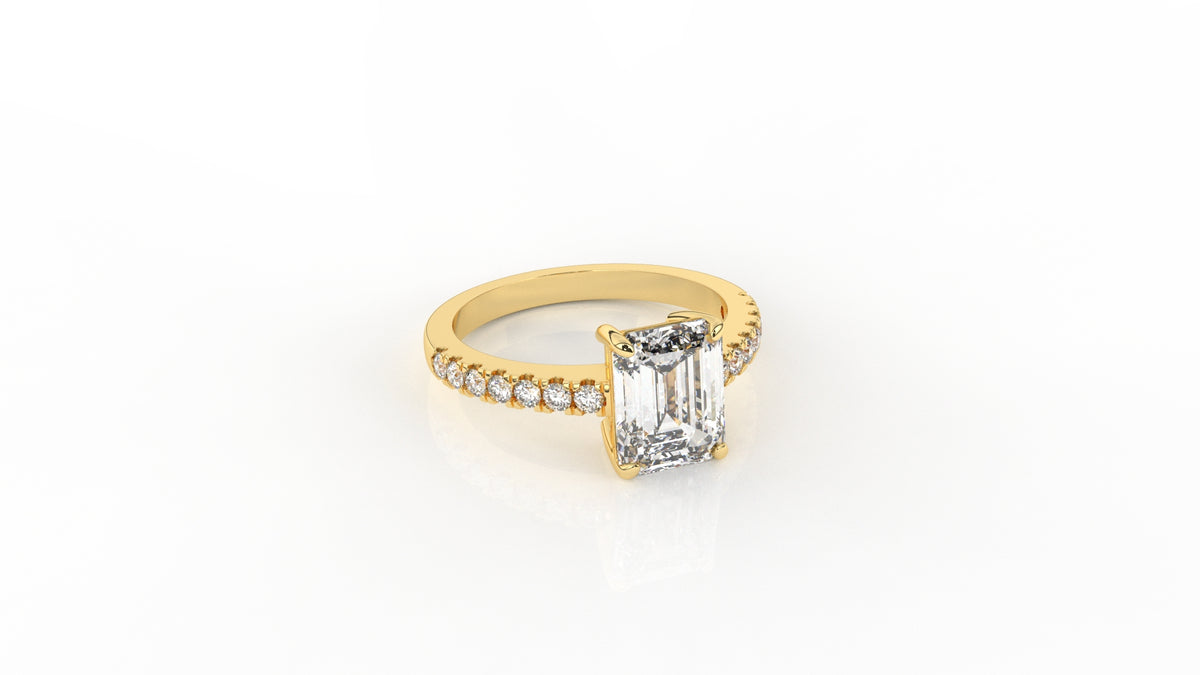Gold ring with a central emerald-cut diamond GLAM NYC