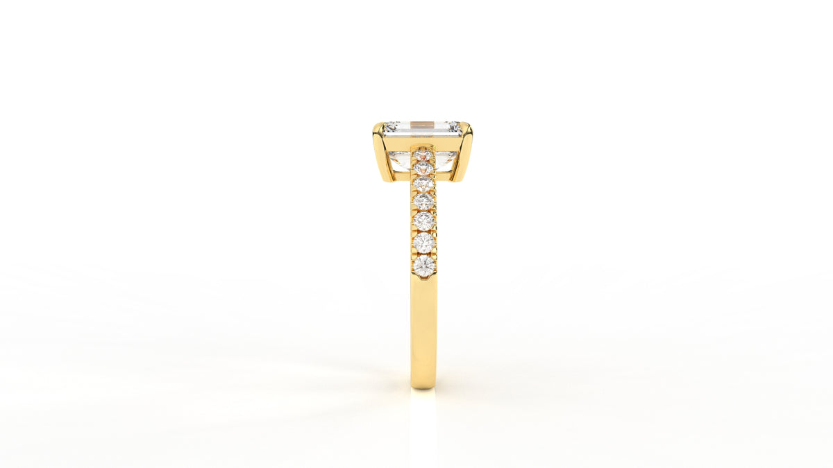 Gold ring with a central emerald-cut diamond GLAM NYC